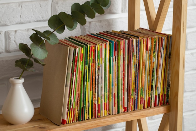 Free Photo stack of old coming book strips on wooden shelf