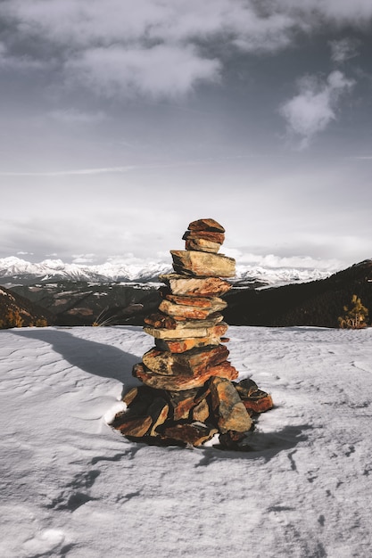 Free photo stack of stones on snow