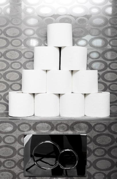 Free Photo stack of toilet paper rolls on shelf