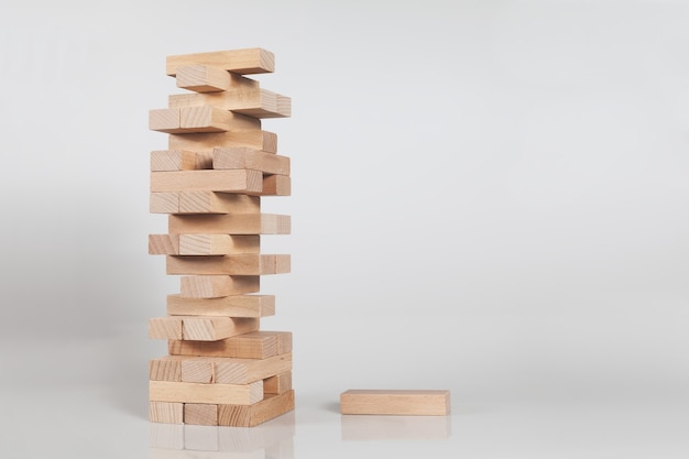 Free Photo stack of a wooden block tower isolated on a white wall