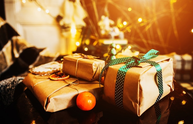 Free photo stacked gifts with green bows and an orange