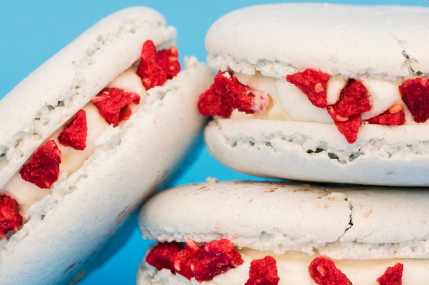 Stacked of white macaroon against blue background