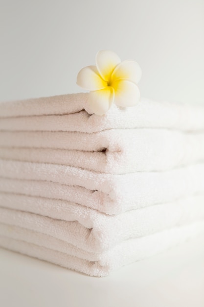 Free photo stacked white towels