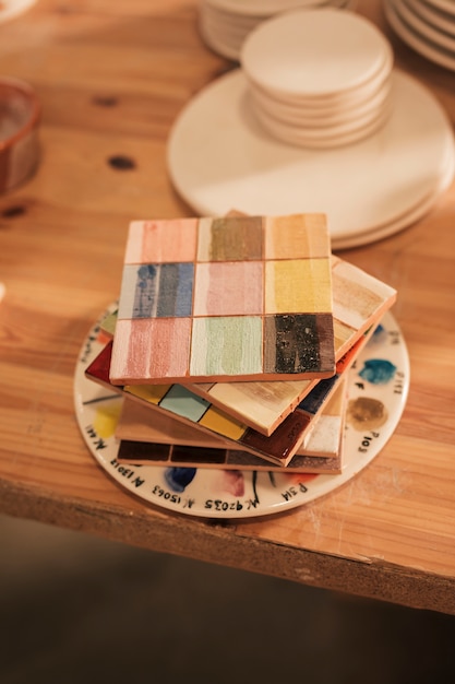 Free Photo stacked of wooden ceramic palette on table