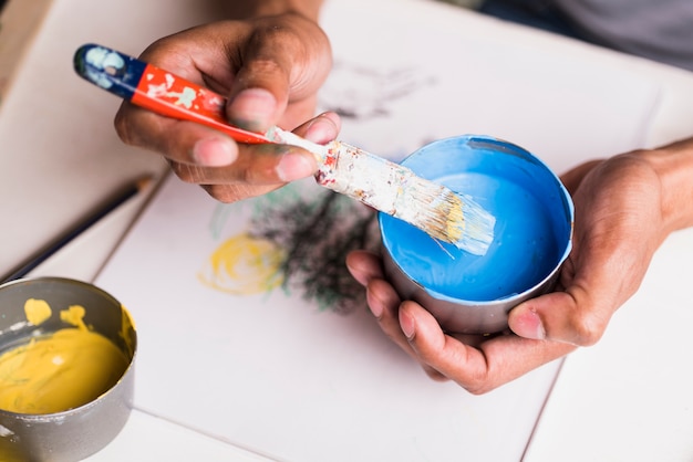 Stained brush with paint bowl