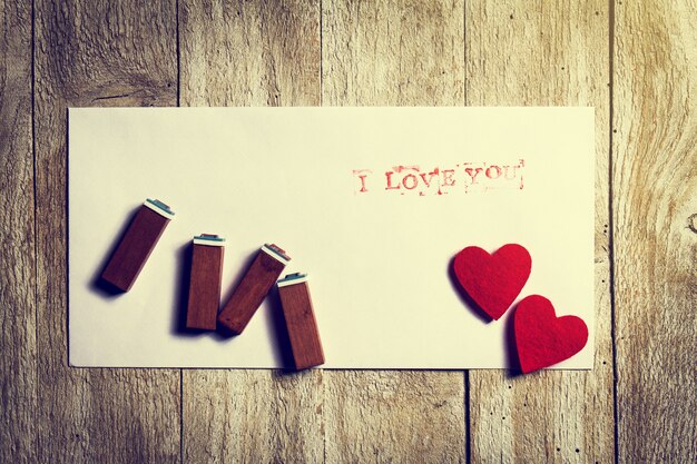 Stamps on a paper with hearts with the phrase "i love you"