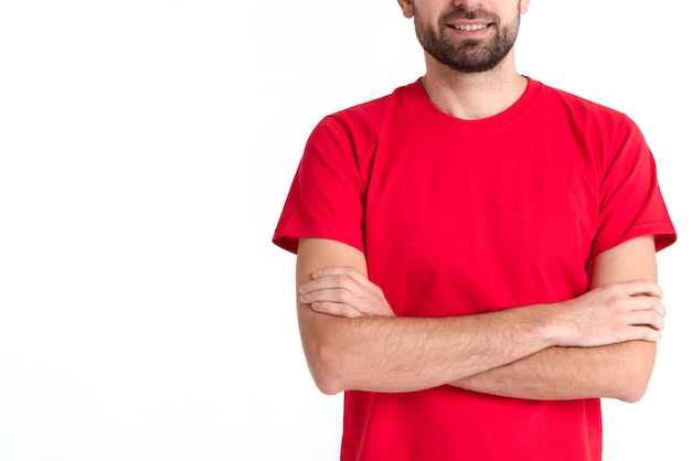 Free photo standing courier man having his arms crossed medium shot