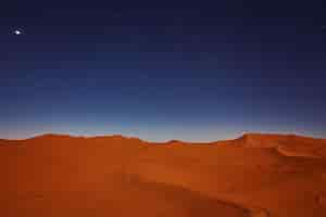 Free photo stars at night over the dunes sahara desert morocco