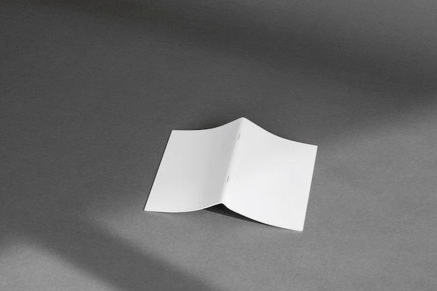 Free photo stationery concept with sheet of folded paper