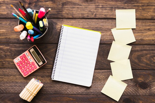 Stationery near notebook on desk