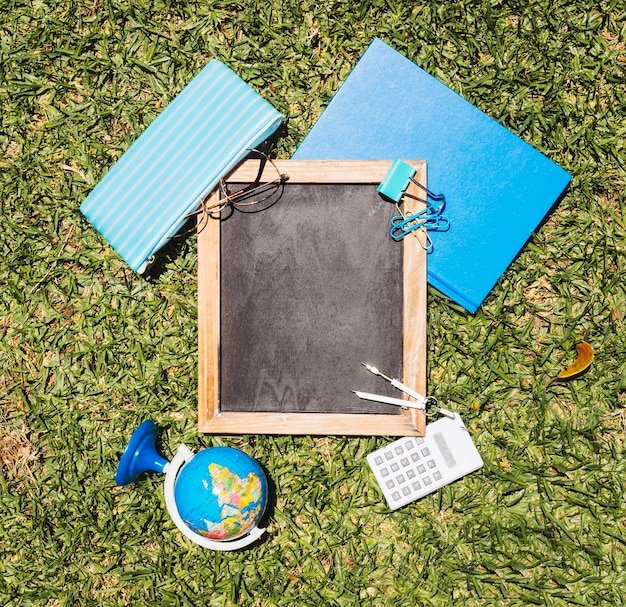 Free photo stationery school set on green lawn