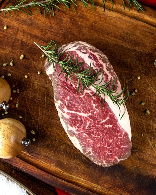 Steak meat  with rosemary  pepper  top view