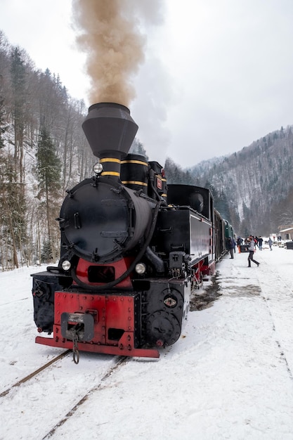 Free photo steam train mocanita on a railway station in winter romania