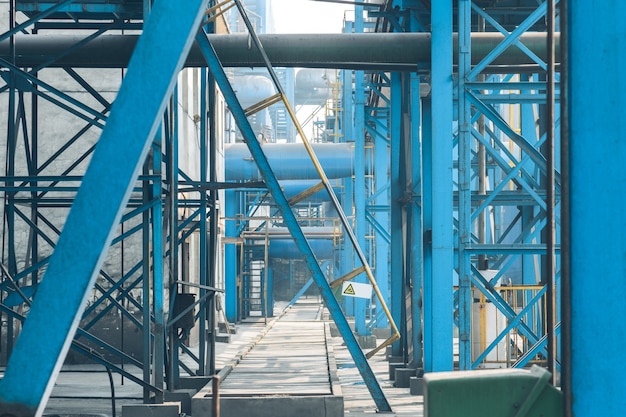 Free photo steel pipelines and cables in a plant