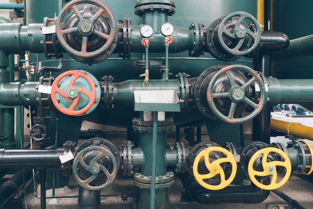 Free Photo steel pipelines and cables in a plant