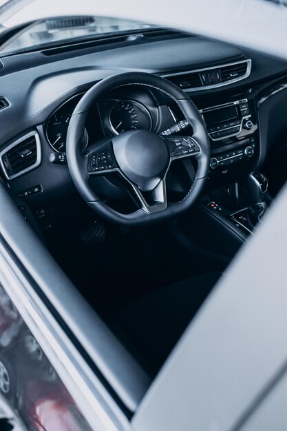 Steering wheel inside a new car close up