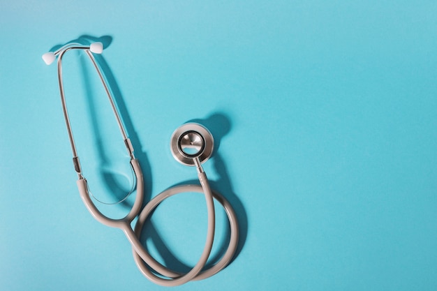 Stethoscope on blue background