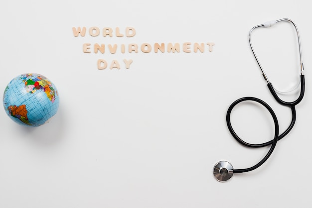 Free Photo stethoscope and globe with word environment day text