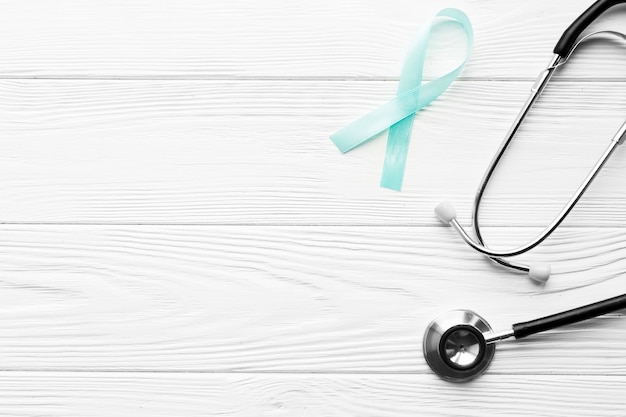 Stethoscope and light blue ribbon