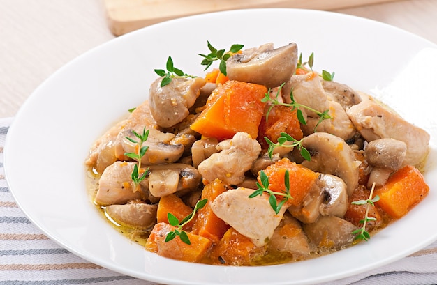 Stew chicken with vegetables and mushrooms in a cream sauce