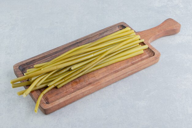 Sticks on a cutting board, on the marble surface