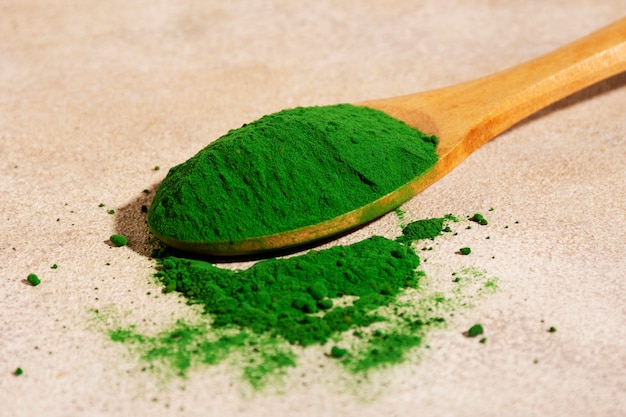 Still life of algae powder in spoon