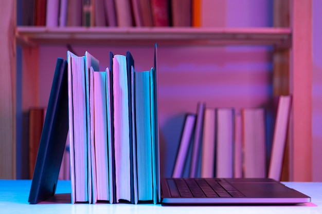 Free photo still life of books versus technology