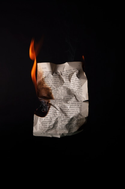 Still life of burnt paper with flames