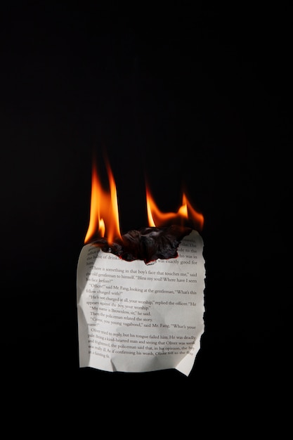 Still life of burnt paper with flames