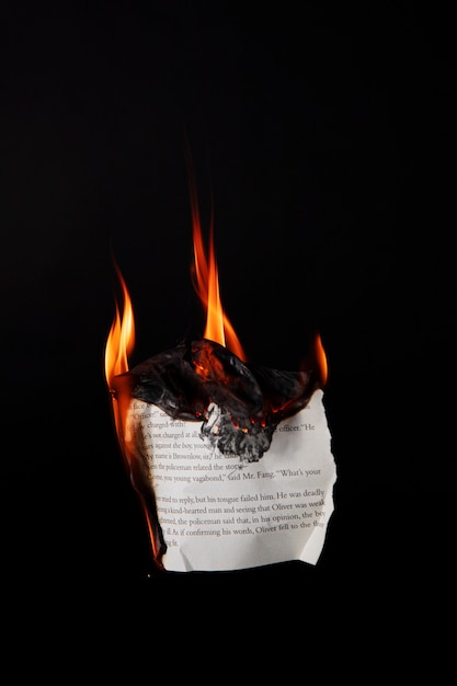 Still life of burnt paper with flames