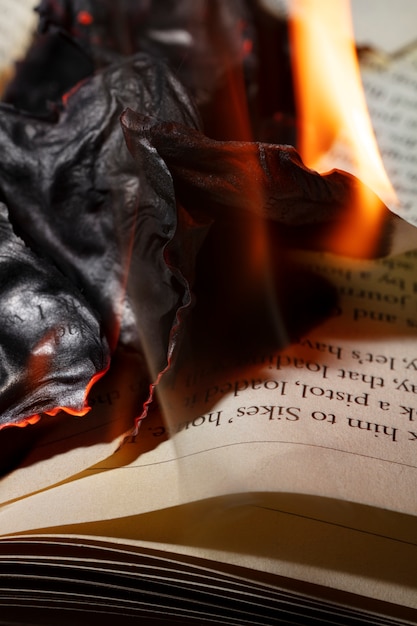 Free Photo still life of burnt paper with flames