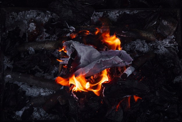 Free photo still life of burnt paper with flames