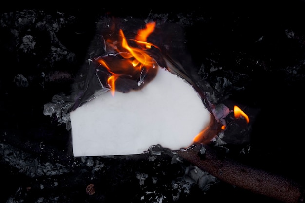 Free photo still life of burnt paper with flames