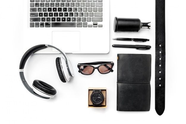 Free photo still life of casual man. modern male accessories and laptop on white