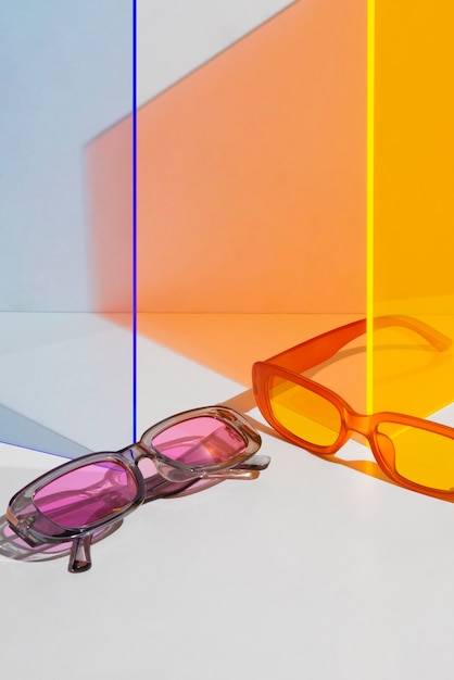 Free photo still life of colored transparent sunglasses