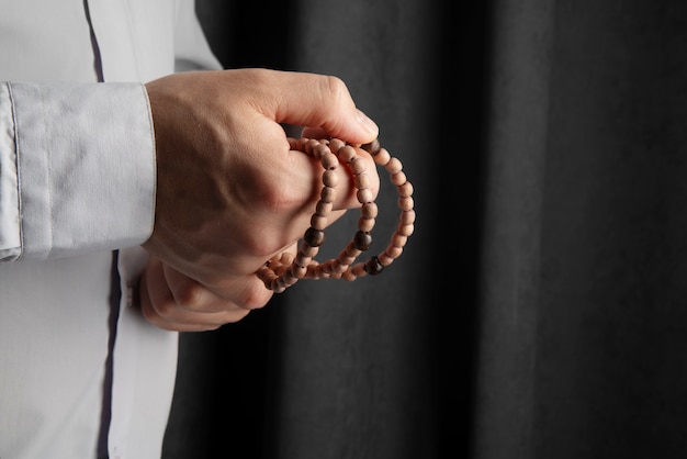 Free photo still life of crucifix held in hand