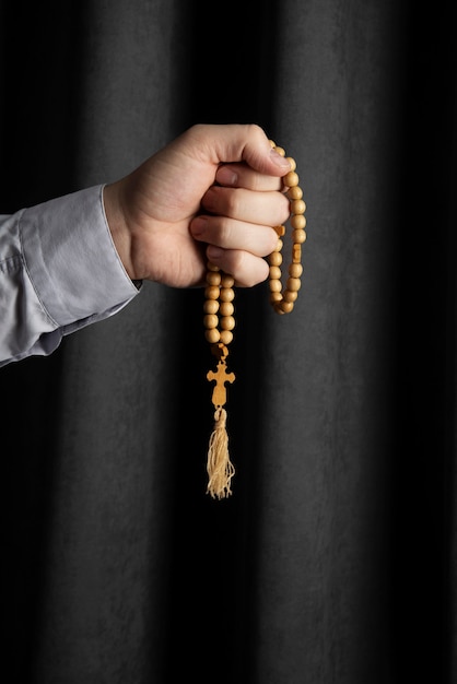 Free photo still life of crucifix held in hand