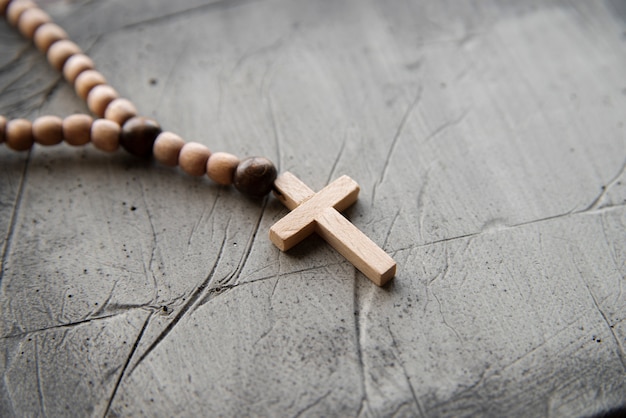 Free Photo still life of crucifix with beads