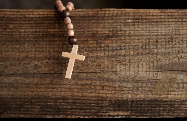 Still life of crucifix with beads