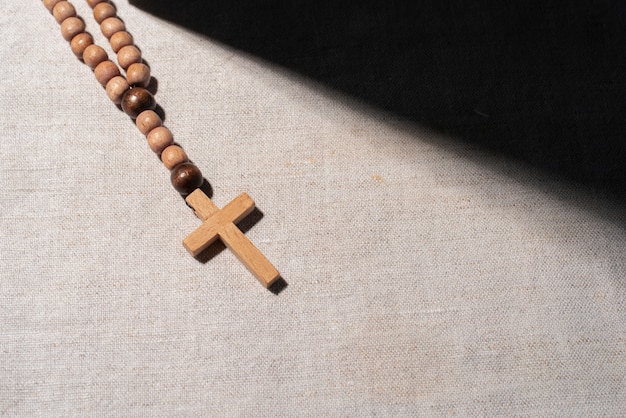 Free Photo still life of crucifix with beads