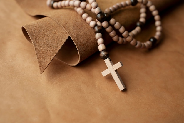 Still life of crucifix with beads