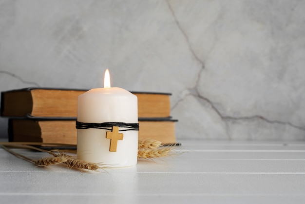 Free Photo still life of crucifix with book and candle