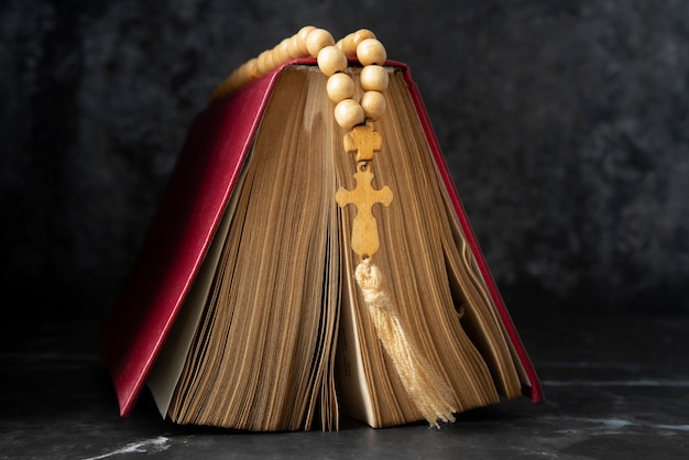 Still life of crucifix with book