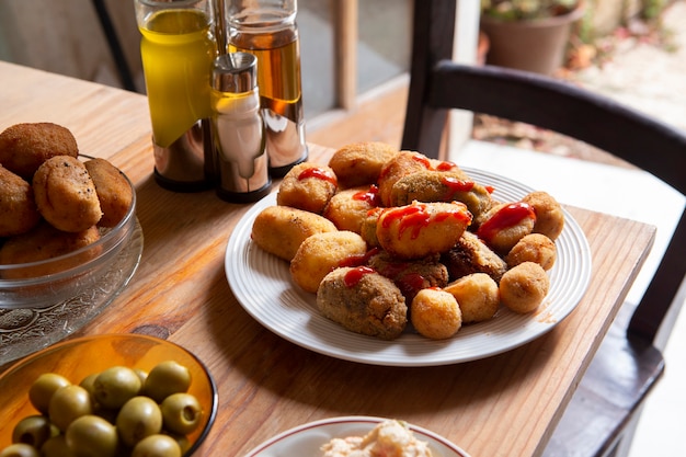 Free Photo still life delicious fried croquette composition