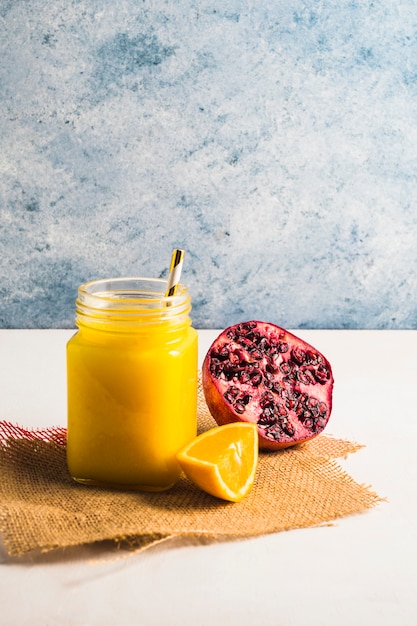 Free photo still life of delicious orange smoothie