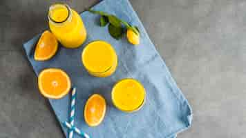 Free photo still life of delicious orange smoothie