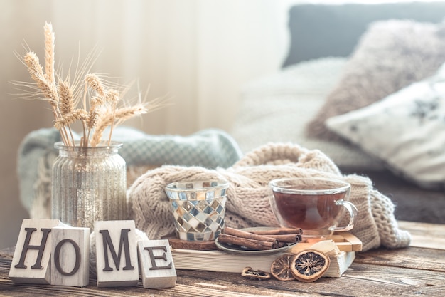 Still life details of home interior on a wooden table with letters home, the concept of coziness and home atmosphere .Living room