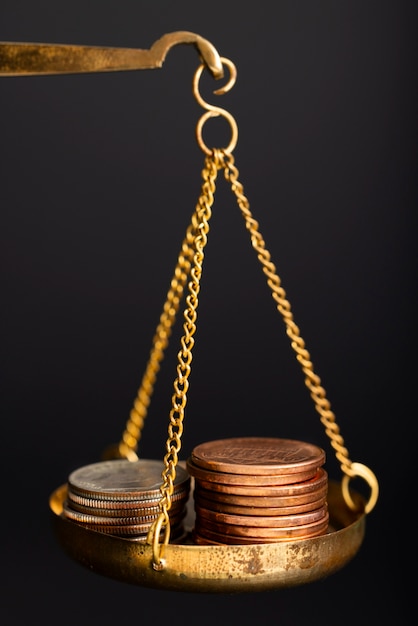 Free photo still life of dollar coins in scale