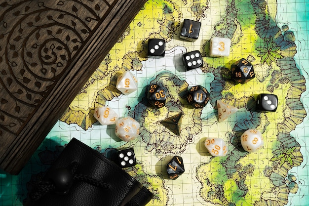 Free Photo still life of map with dices