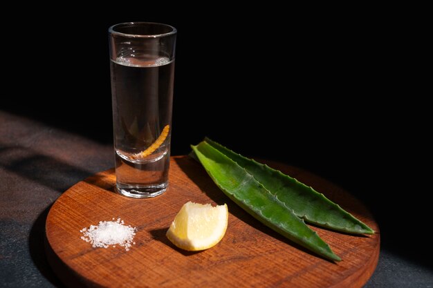 Still life of mezcal drink with maguey worm